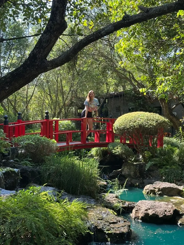Female rider exploring a garden stop on the 140 km motorbike loop near Chiang Mai