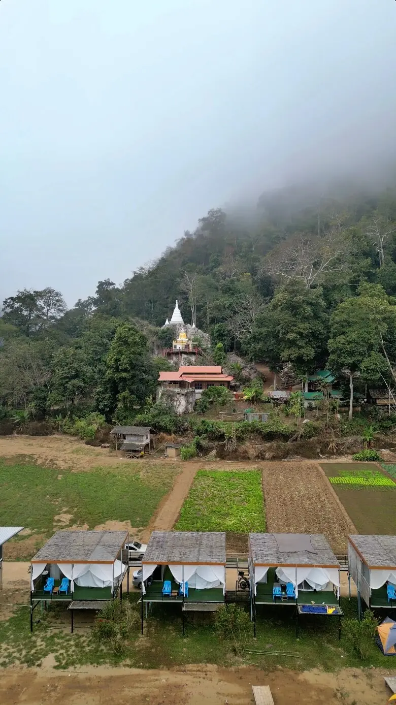 Misty hillside temple on the mountain backroad from Pai to Chiang Mai, Northern Thailand motorcycle ride