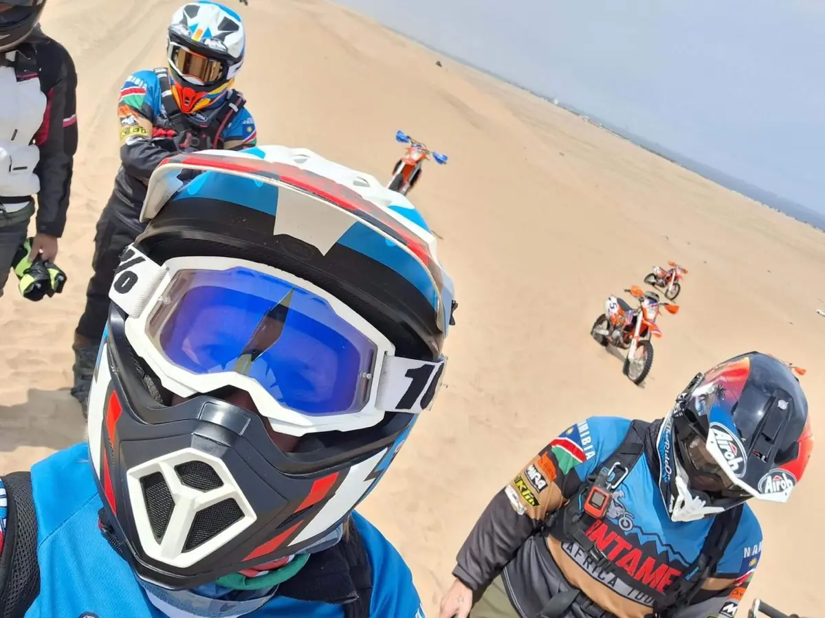 Guided motorcycle tour stop on the Skeleton Coast, Namibia